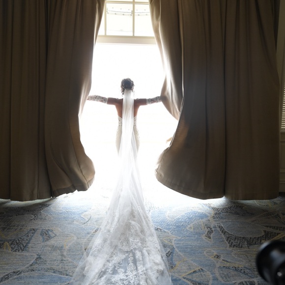 Elegant White Bridal Gown with Lace Train